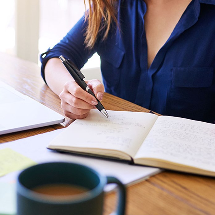 Woman writing notes